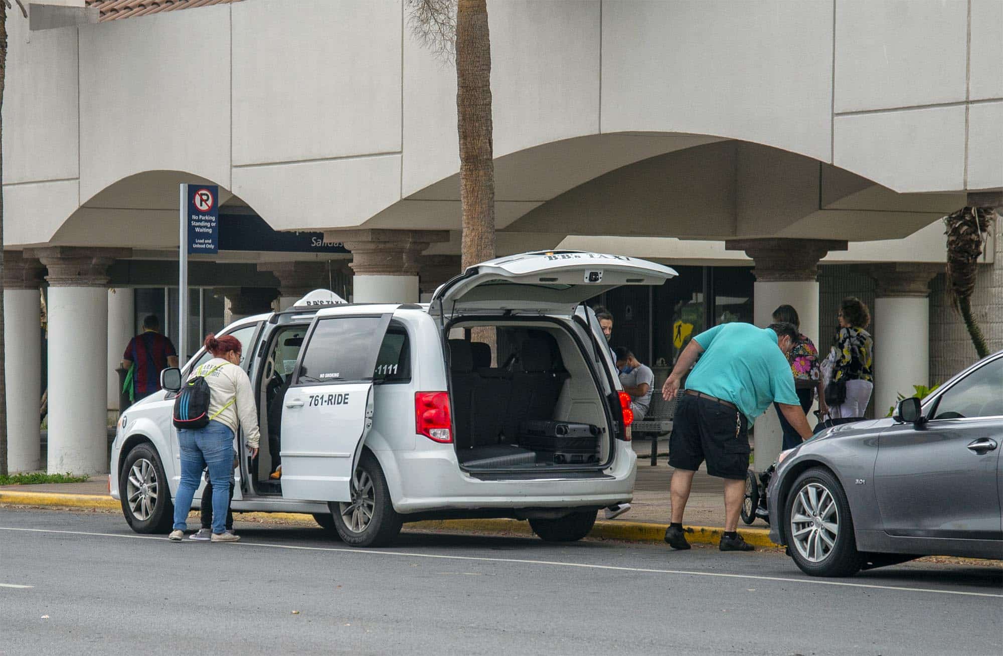 Passengers arrive at Valley International Airport in Harlingen this past week via taxi. The onset of the coronavirus pandemic last year led to less airport traffic causing Valley International Airport's exclusive taxi service to leave town. Now local taxi services as well as several taxi companies from South Padre Island are providing transportation services to airport customers. 