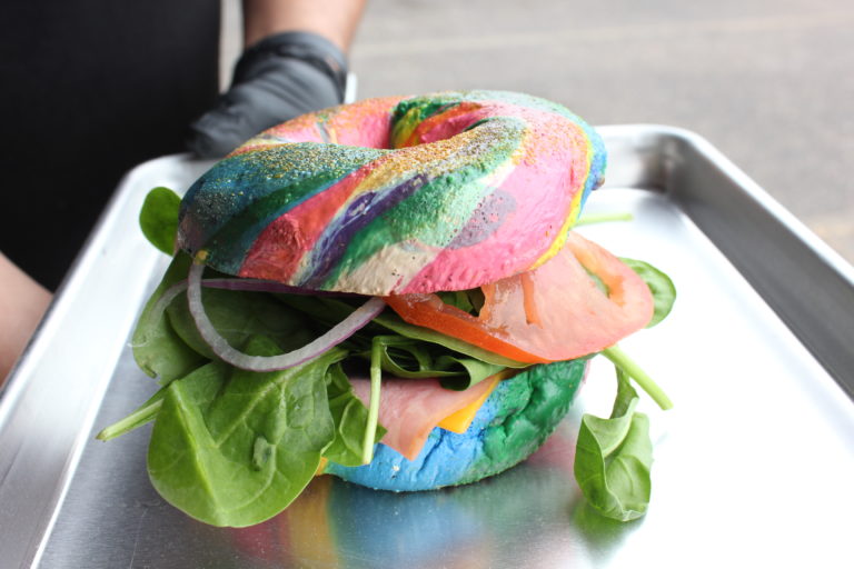 An eclectic rainbow bagel sandwich from WillieDean Bagels. 