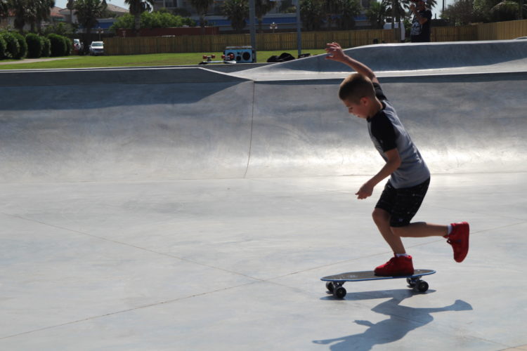 A boy riding a skateboard