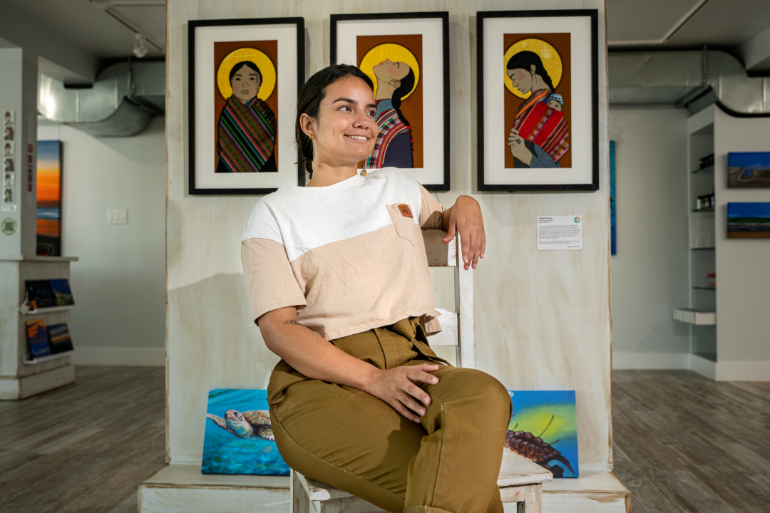 ABI artist Cristina Piecuch poses in front of her work.