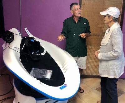 Robert Gallagher explains to a visitor how to enjoy the upcoming visual experience at Nana’s 9VR on South Padre Island.