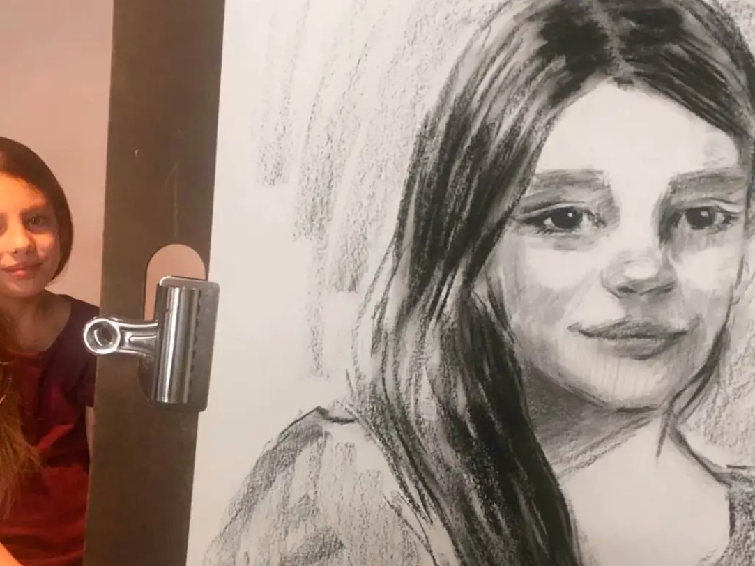 Drawing live portraits gives Malia Quinn an opportunity to connect with her customers and give visitors a glimpse into the world of art. (Courtesy)